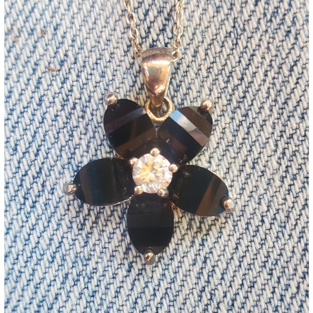 Black flower with crystal on silver necklace